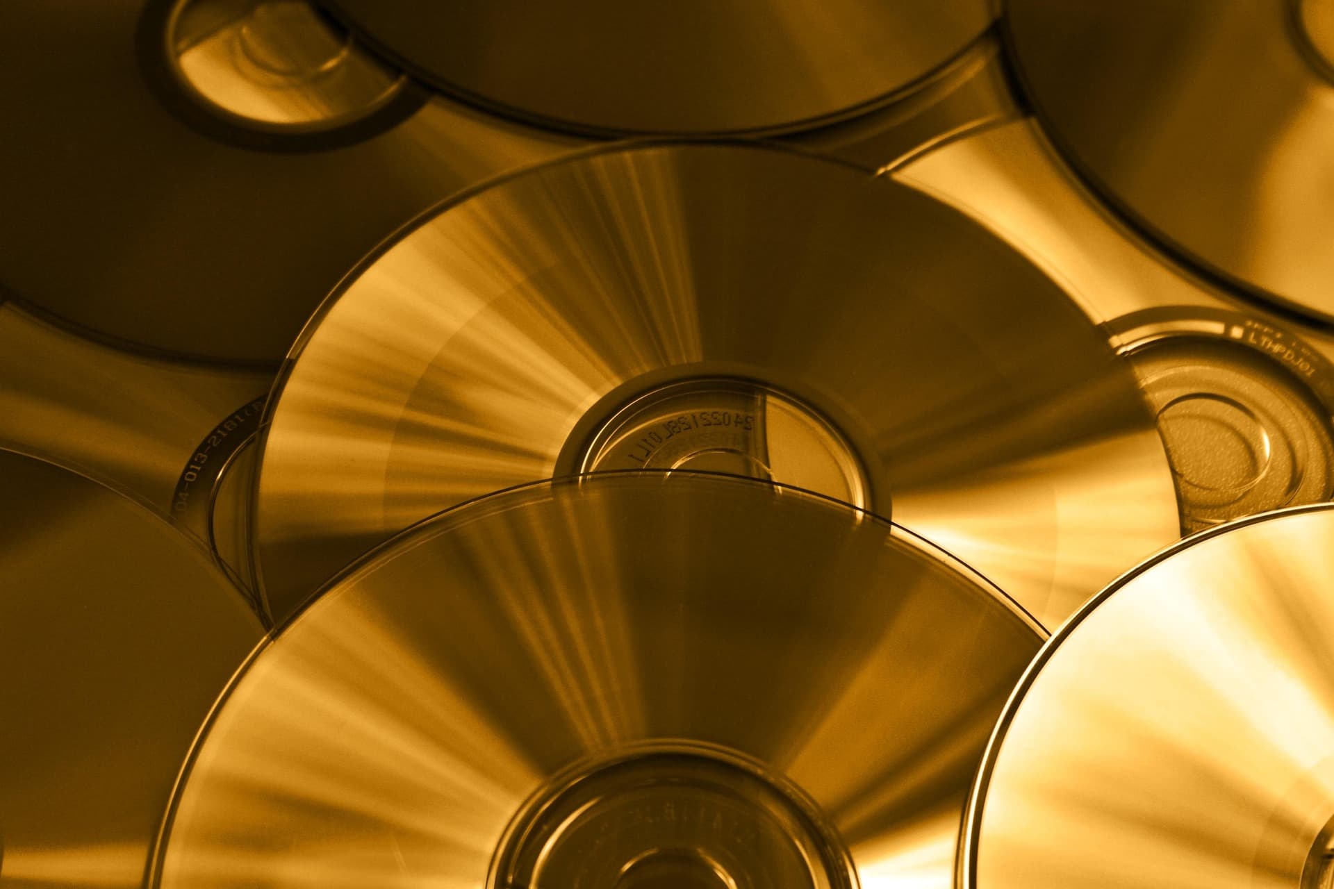 A pile of DVDs catching the light